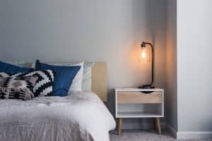 bedroom with bed sidetable and lamp